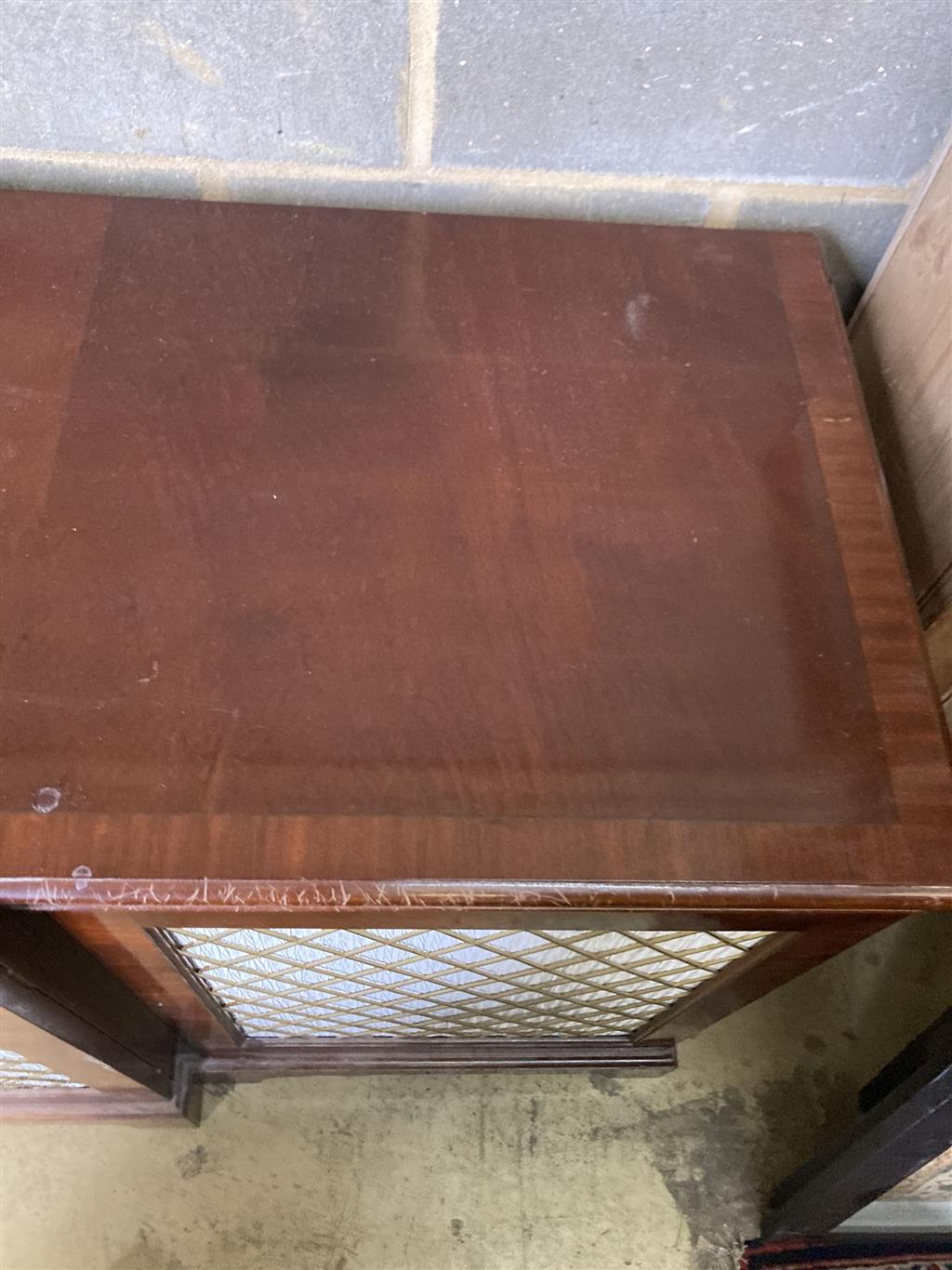 A Regency style mahogany breakfront cabinet, width 240cm, depth 64cm, height 91cm